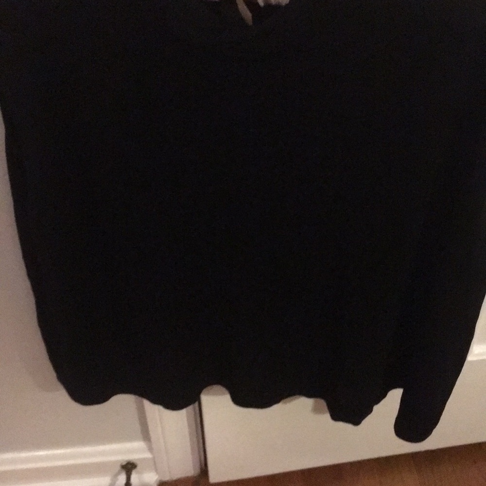Black sleeveless top.